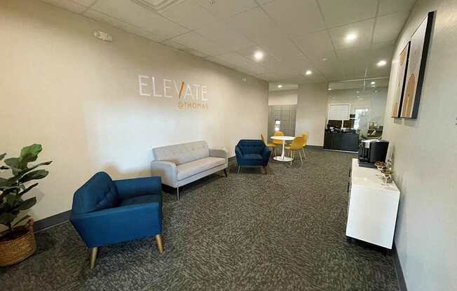 A room with a white wall that says ELEVATE on it.