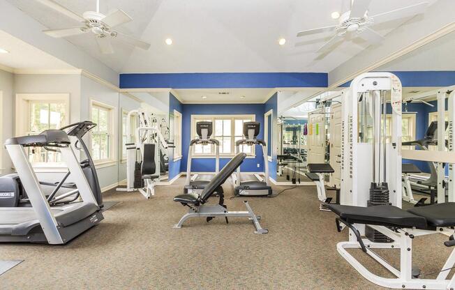 a room filled with furniture and a blue chair