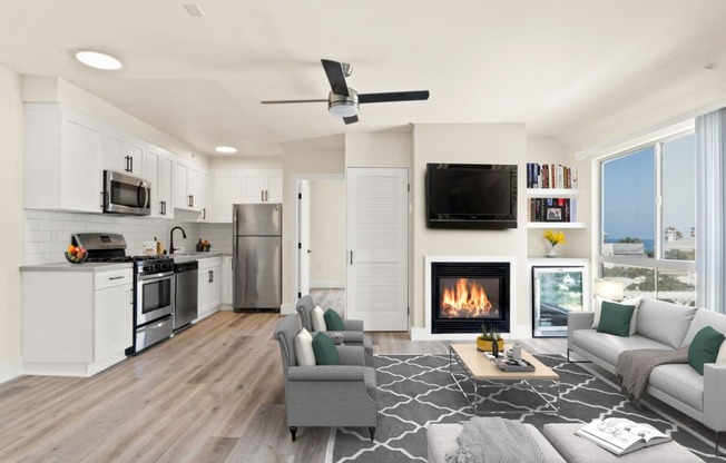 a living room with a fireplace and a kitchen with a stove and refrigerator