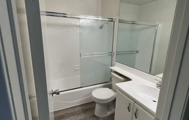 Bathroom with Hardwood Floors and Bathtub/Shower