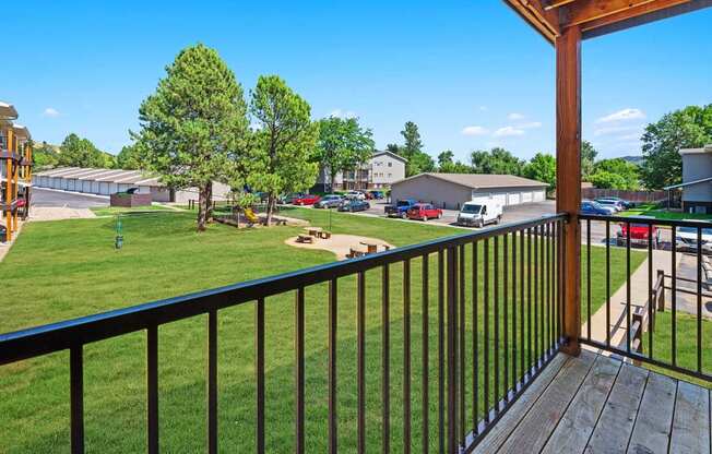 a view of the yard from the balcony of a house