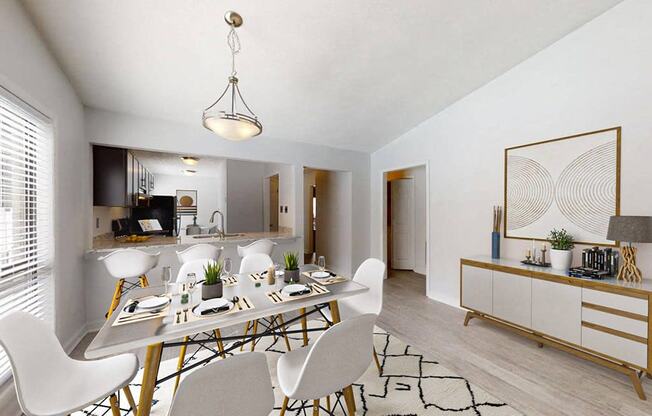 a dining room and kitchen area with a table and chairs