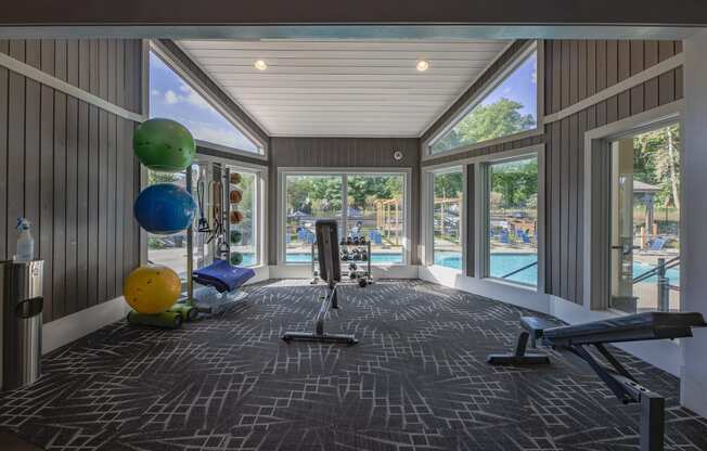 a gym with windows and a view of a pool  at Butternut Ridge, Ohio