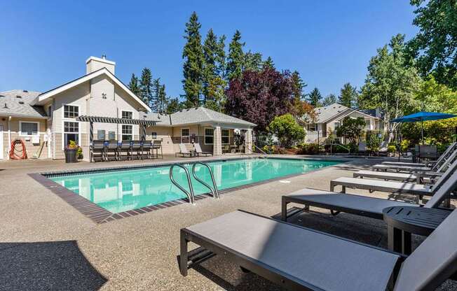 A large house with a pool in the backyard.
