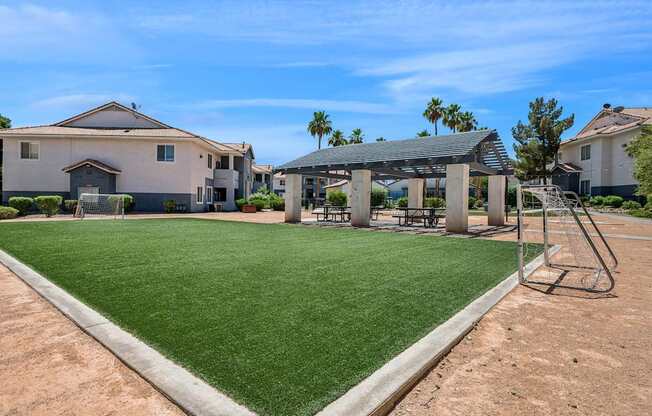 A house with a green lawn and a playground.