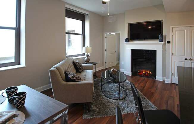Living Room With Fireplace at The Terminal Tower Residences Apartments, Ohio