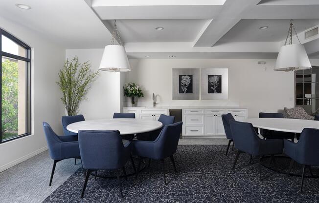 a living room filled with furniture and a large window