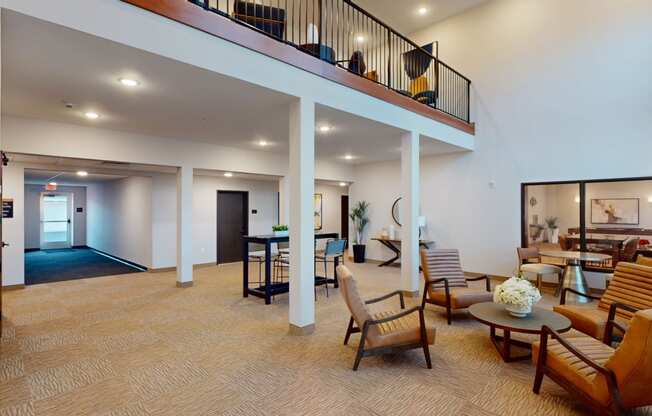 the living room and dining area of a house with a balcony