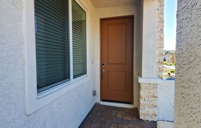 Contemporary townhome with modern exterior and attached garage.