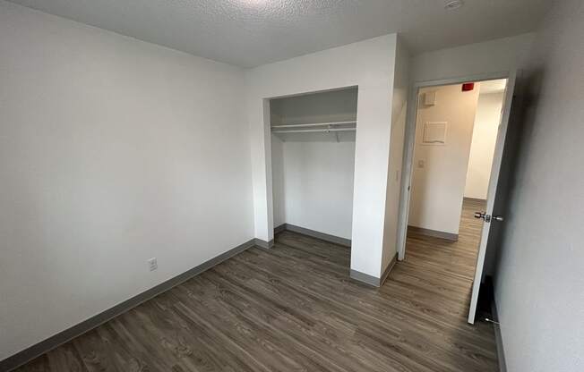 an empty room with a hallway and a closet at Kings Court, Anchorage Alaska ? 