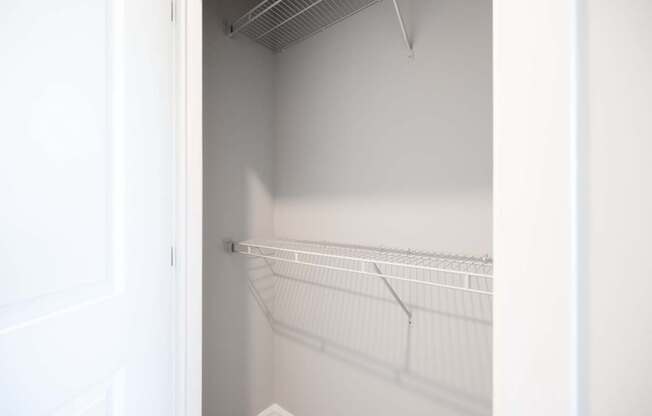 Empty white shelves in a white room. at Harbor Pointe, New Jersey, 07002