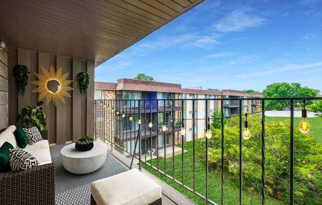 a balcony with a view of a garden and a building