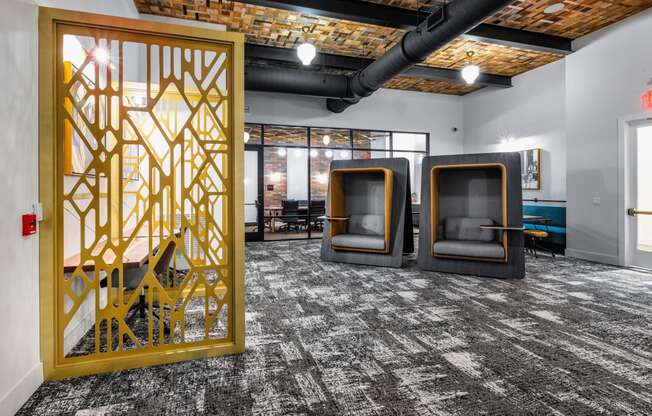 a room with three chairs and a large yellow screen