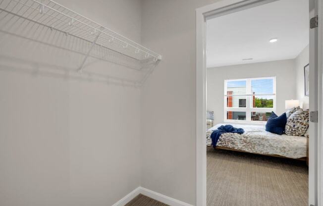 a bedroom with a bed and a closet