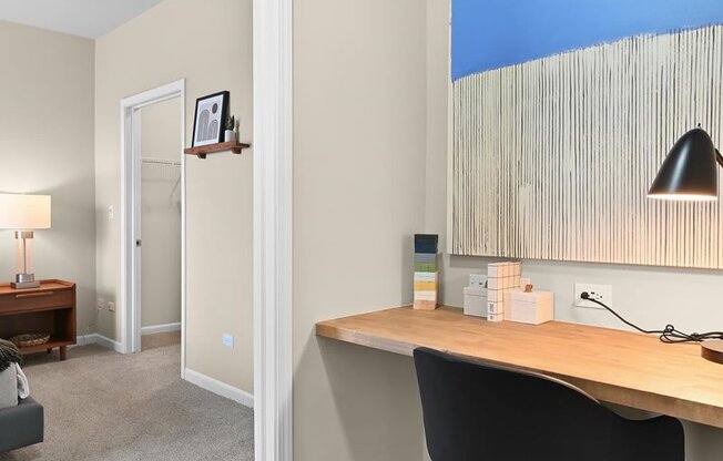built-in wood desk in an office area near the homes bedroom