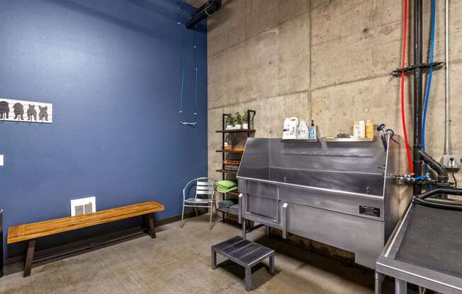 a kitchen with a stainless steel stove and a bench