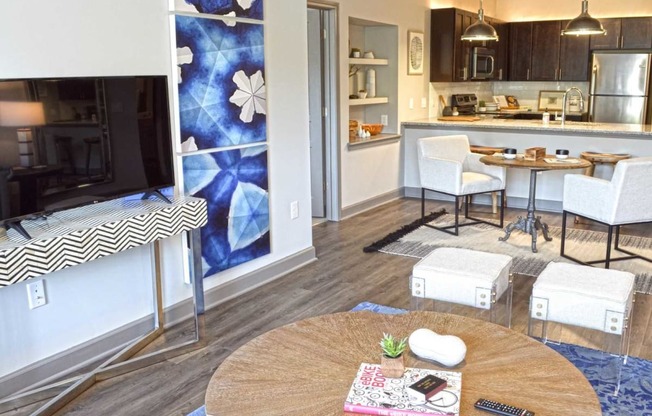 a living room with a table and a television