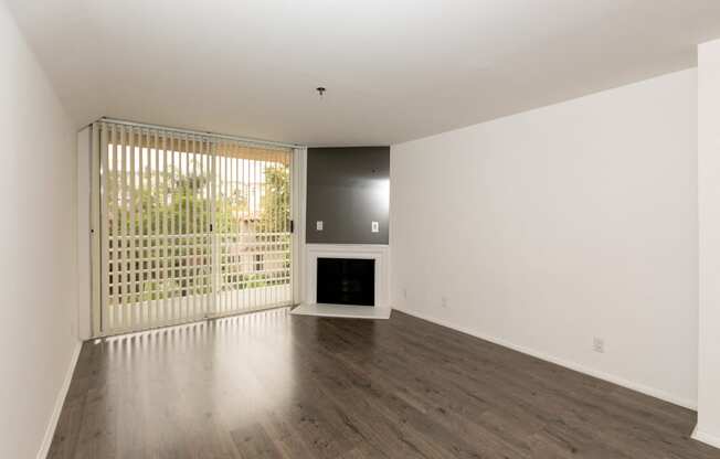 Living Room with Hardwood Floors, Fireplace and Patio Doors