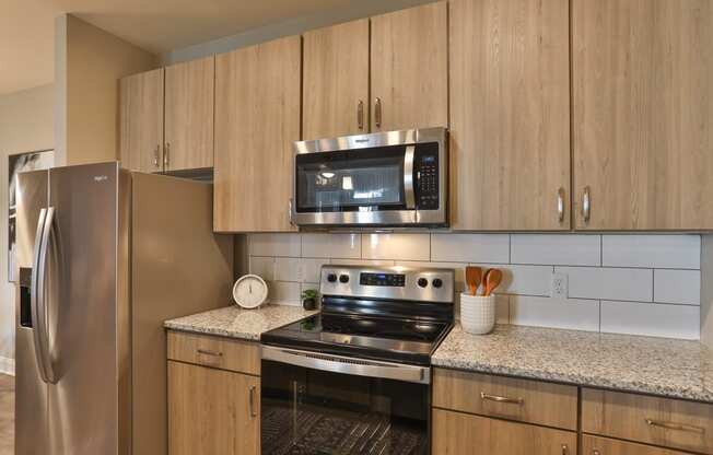 Kitchen with Granite Countertops-1, 2, and 3 bedroom apartments-Argento at Riverwatch Apartments in Augusta, Georgia