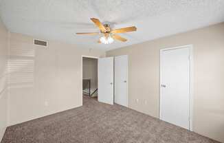 a living room with carpet and a ceiling fan at Brookside Apartments, Hewitt, TX, 76643