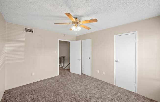 a living room with carpet and a ceiling fan at Brookside Apartments, Hewitt, TX, 76643