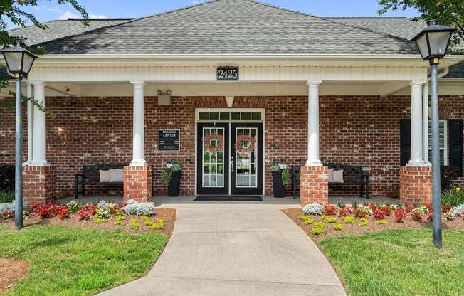 A building with a black door and a sign that says 2425.