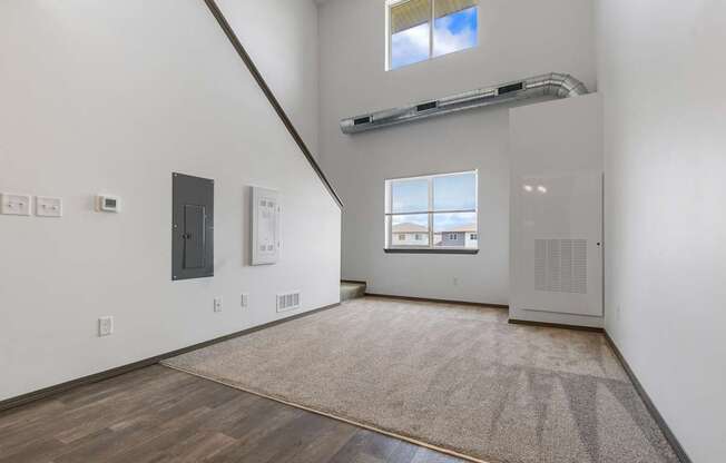 A room with a window and a door on the right side.