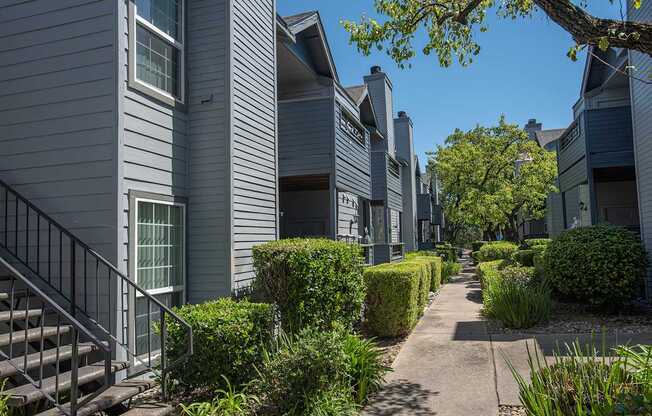 Grey apartment building exterior and entryways at Rocklin Gold Apartments in Rocklin, CA 95677