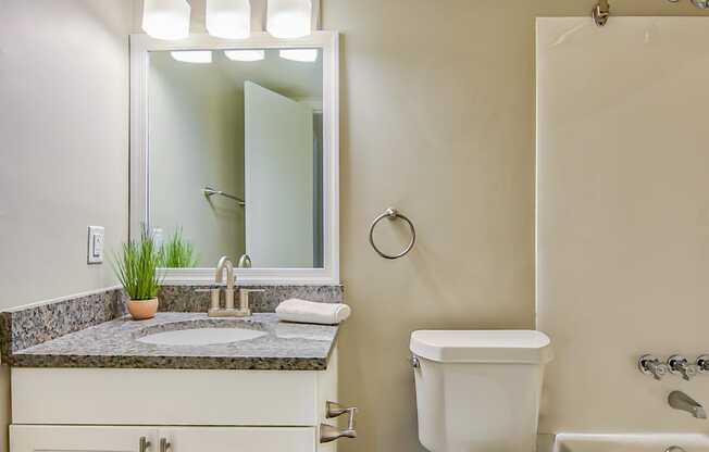 a bathroom with a toilet sink and bathtub