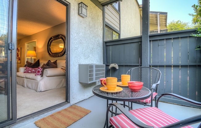 A patio with a table and chairs is shown.