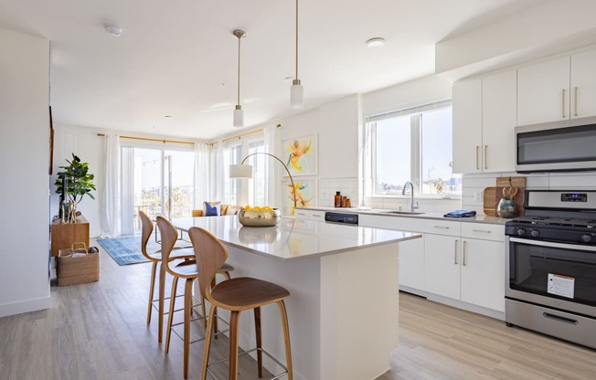 Bright kitchen with large island at The Chandler Apartments in North Hollywood