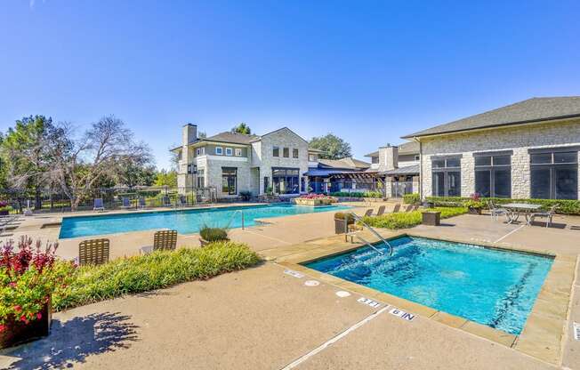 Sparkling swimming pool with a jacuzzi spa at Cypress Lake at Stonebriar in Frisco, TX!