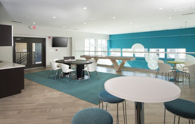 Gaming and entertaining space with poker table and shuffleboard