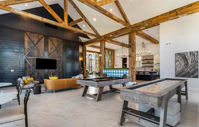 A modern living room with a wooden ceiling and a large coffee table.