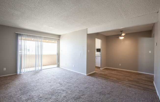 Living room and dining area at Brookwood Apartments in Tucson AZ 3-2020