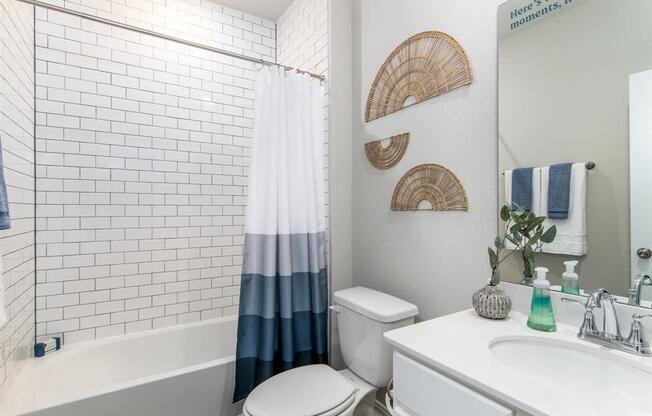a bathroom with a toilet sink and bathtub