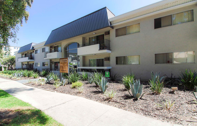 Drought-tolerant greenery decorating the entrance to Rose Apartments.
