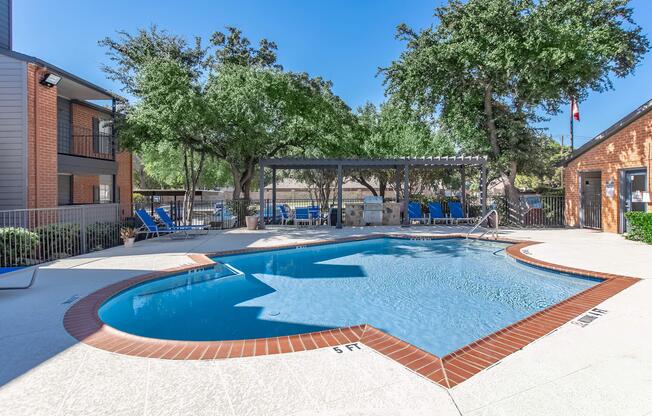 a house with a pool outside of a building