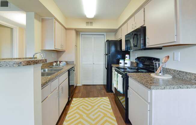 this is a photo of the kitchen in a 1 bedroom apartment at deer hill apartments in c