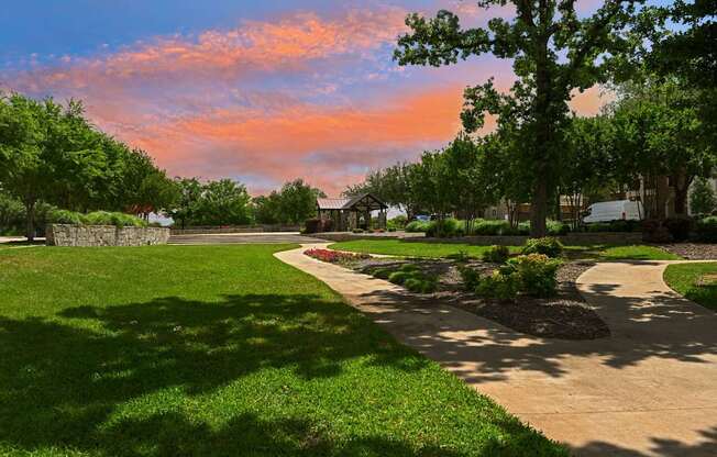 A beautiful park with a pathway and trees.