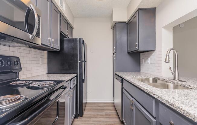 a large kitchen with stainless steel appliances