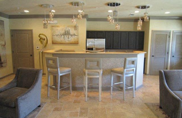 A bar area with four chairs at Forest Hill, Mobile, AL, 36618