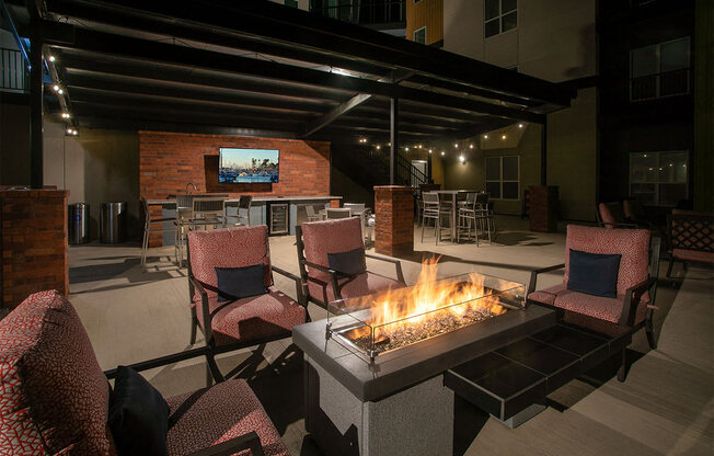 the lobby of the building has a fireplace and a wall of quilts at Aster Apartments, Beachwood, OH 44122