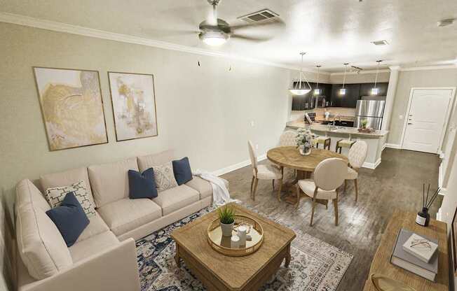 A living room with a beige couch, a wooden coffee table, and a ceiling fan.