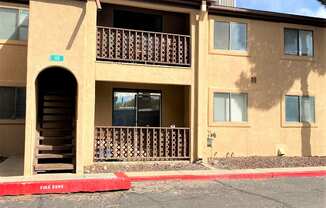 A building with a red line on the ground in front of it.