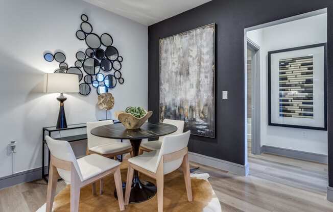 a dining room with a table and chairs