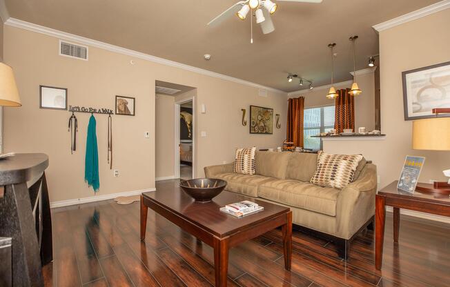 a living room filled with furniture and a mirror