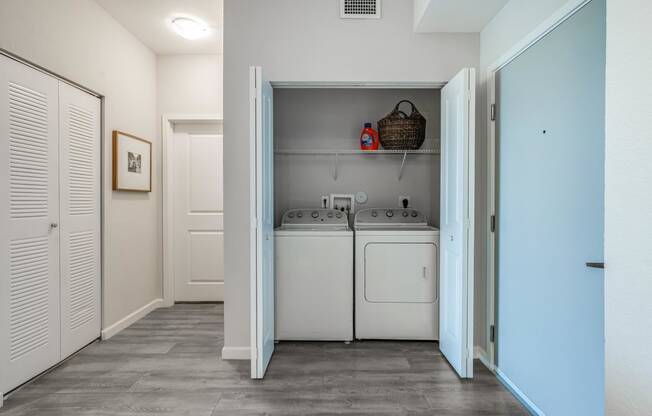 a small laundry room with a washer and dryer in it