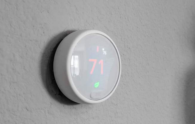 A thermostat shows the temperature as 71 degrees.