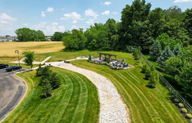 A picnic area with a table surrounded by trees.